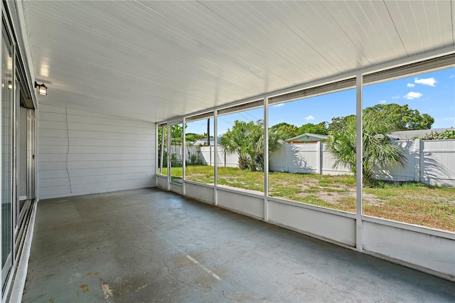 unfurnished sunroom with vaulted ceiling