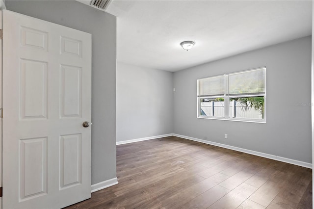 spare room featuring hardwood / wood-style floors