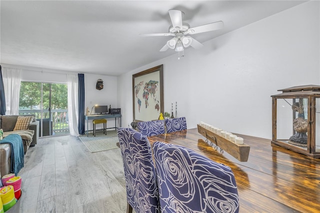 living room featuring hardwood / wood-style flooring and ceiling fan