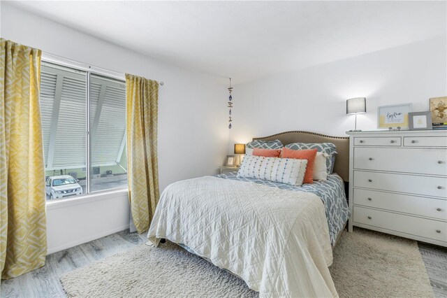 bedroom with light hardwood / wood-style floors