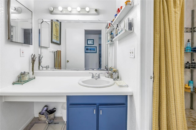 bathroom with a shower with curtain and vanity