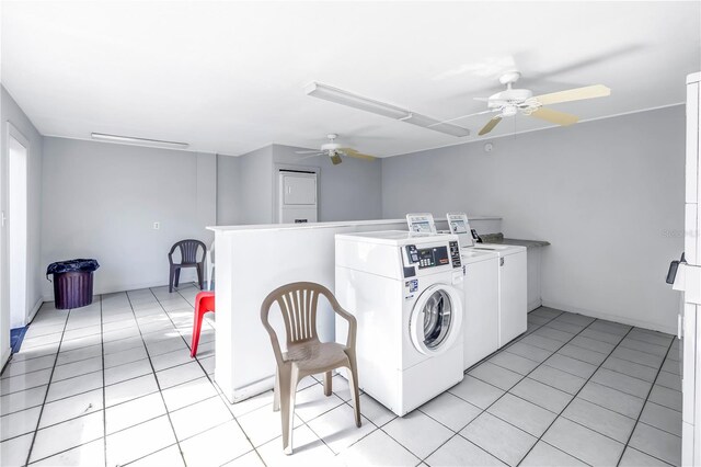 laundry room with ceiling fan, light tile patterned floors, and separate washer and dryer