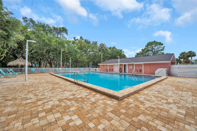 view of swimming pool with a patio area