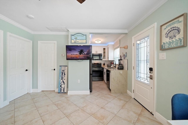 tiled entrance foyer with ornamental molding and sink