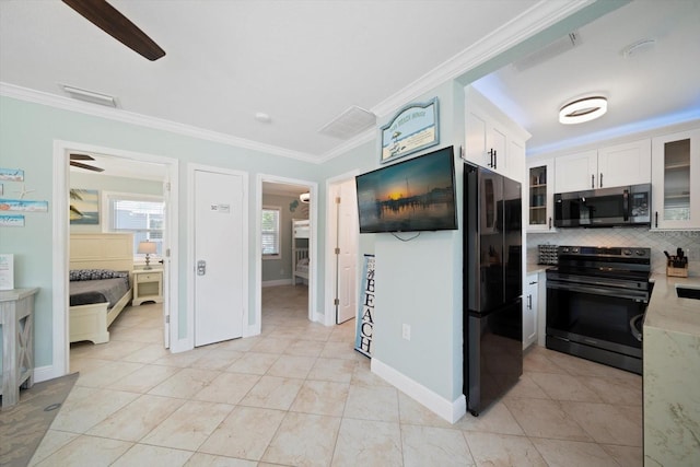 kitchen featuring ceiling fan, ornamental molding, backsplash, white cabinetry, and appliances with stainless steel finishes