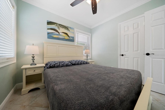 bedroom with light tile patterned flooring, ornamental molding, ceiling fan, and a closet