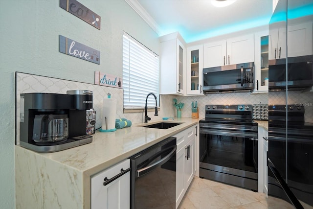 kitchen with appliances with stainless steel finishes, ornamental molding, sink, and white cabinets