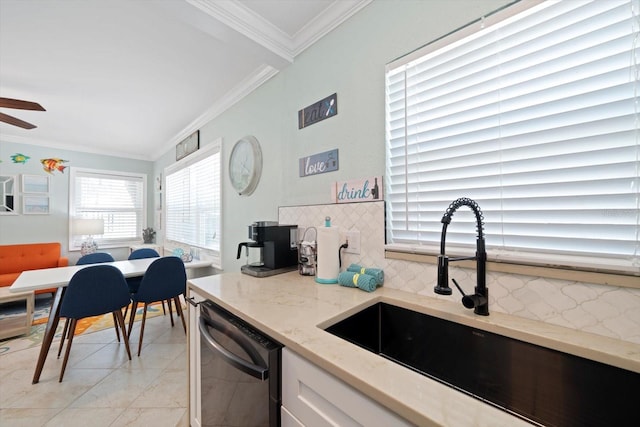 kitchen with backsplash, dishwasher, ceiling fan, and sink