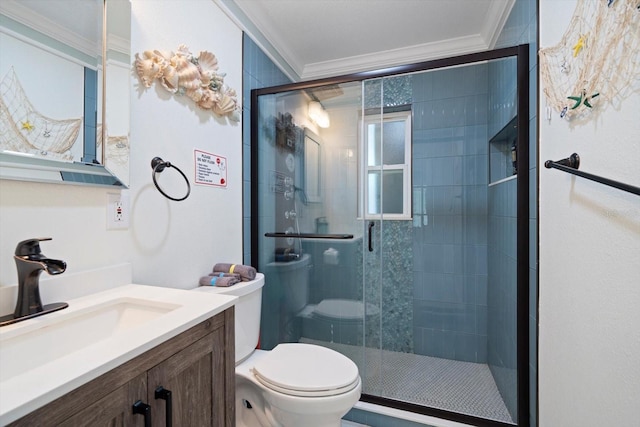 bathroom featuring ornamental molding, an enclosed shower, vanity, and toilet