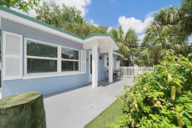 entrance to property with a patio area