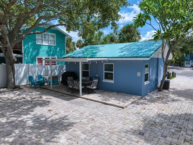 rear view of house featuring a patio area