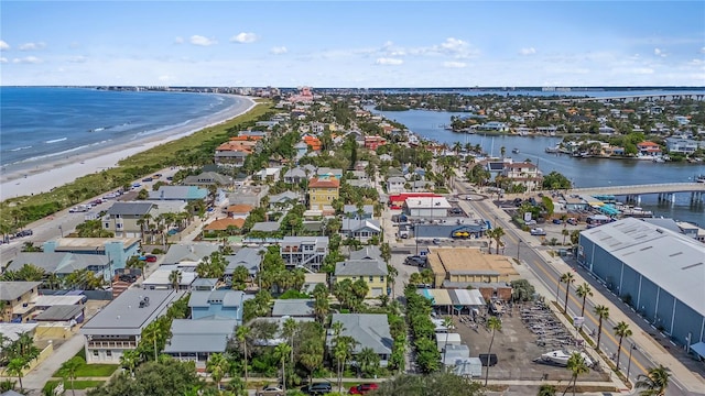 aerial view with a water view and a beach view