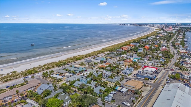 birds eye view of property with a beach view and a water view