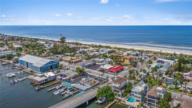 bird's eye view with a water view and a view of the beach