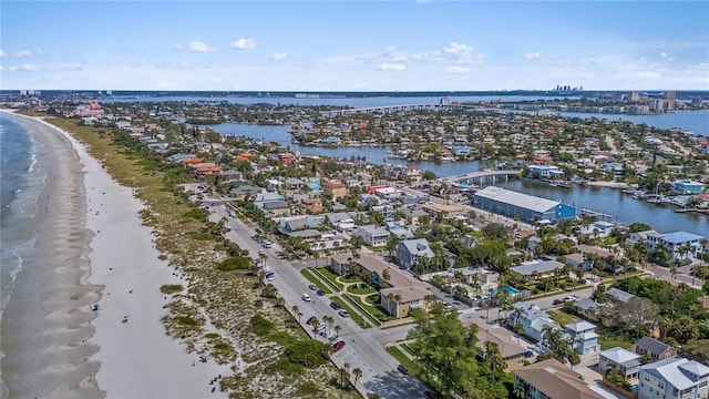 aerial view featuring a water view and a view of the beach