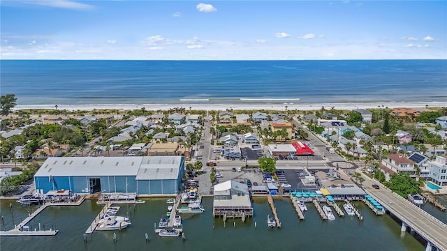 birds eye view of property with a beach view and a water view