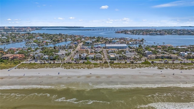 birds eye view of property featuring a water view and a view of the beach