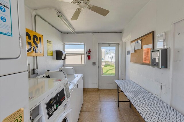 laundry area featuring light tile patterned flooring, washer and dryer, and ceiling fan