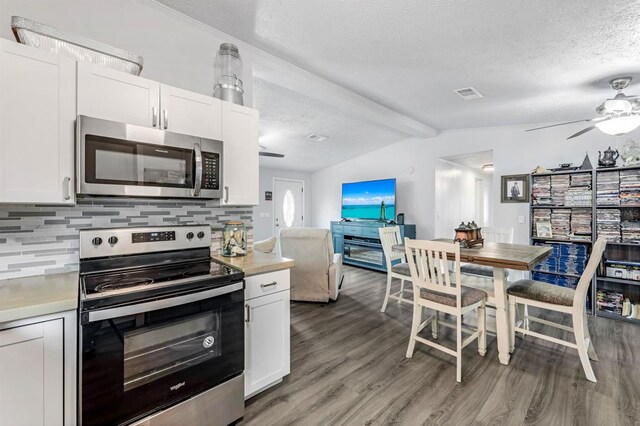 kitchen featuring visible vents, light wood-style floors, appliances with stainless steel finishes, and light countertops