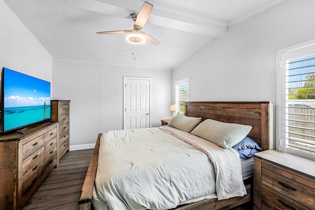 bedroom with dark wood-type flooring, multiple windows, ceiling fan, and vaulted ceiling with beams