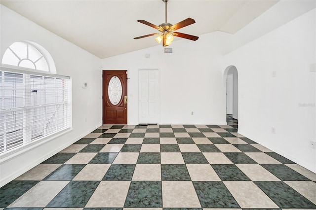 entrance foyer featuring ceiling fan and vaulted ceiling