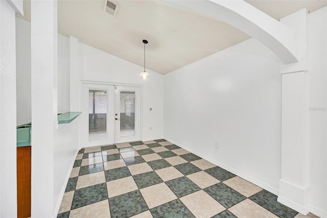 interior space with french doors and vaulted ceiling