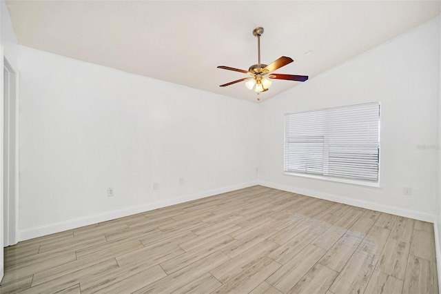 empty room with light hardwood / wood-style floors, vaulted ceiling, and ceiling fan