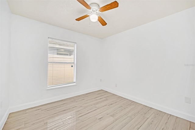 spare room featuring ceiling fan and light hardwood / wood-style flooring