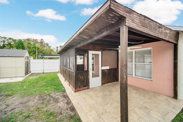 view of patio / terrace featuring a storage shed