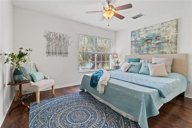 bedroom with dark hardwood / wood-style floors and ceiling fan