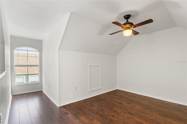 bonus room featuring dark wood-type flooring, ceiling fan, and lofted ceiling