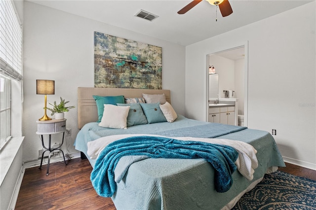 bedroom with sink, ensuite bath, dark hardwood / wood-style floors, and ceiling fan