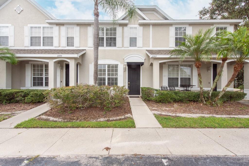 townhome / multi-family property with covered porch