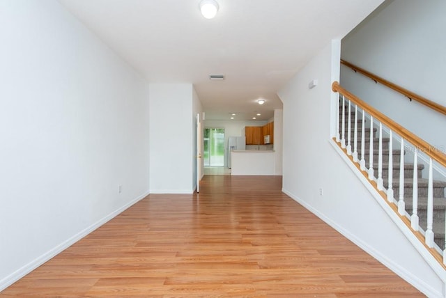 unfurnished room with light hardwood / wood-style flooring