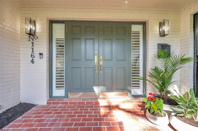 doorway to property featuring covered porch