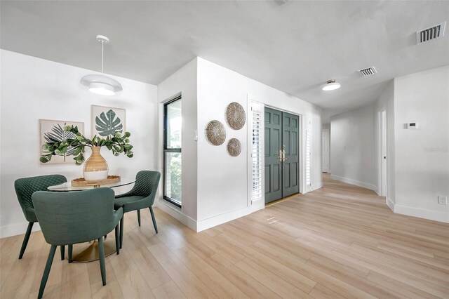 dining room featuring light hardwood / wood-style floors