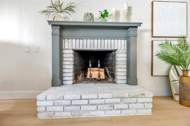 room details featuring wood-type flooring and a fireplace