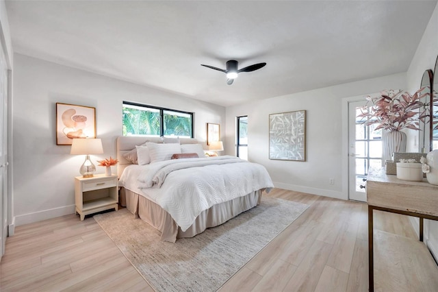 bedroom with ceiling fan and light hardwood / wood-style flooring