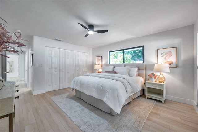 bedroom with ceiling fan and light hardwood / wood-style floors