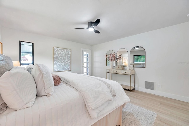 bedroom with ceiling fan and light wood-type flooring