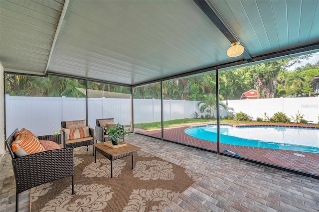 sunroom / solarium featuring a pool and a healthy amount of sunlight