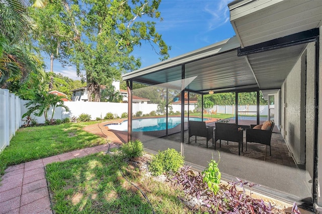 view of yard featuring a fenced in pool and a patio area