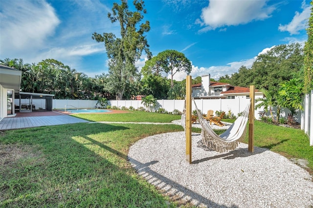 view of yard featuring a patio and a deck