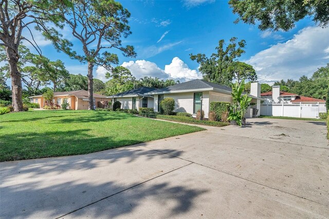 ranch-style house with a front yard