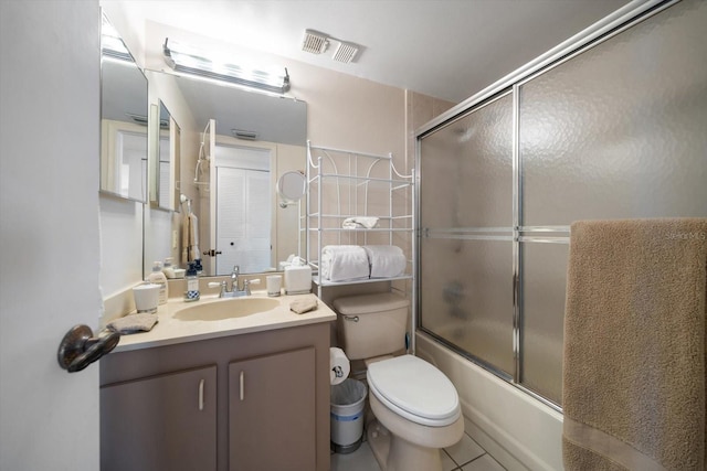 full bathroom with bath / shower combo with glass door, vanity, and toilet