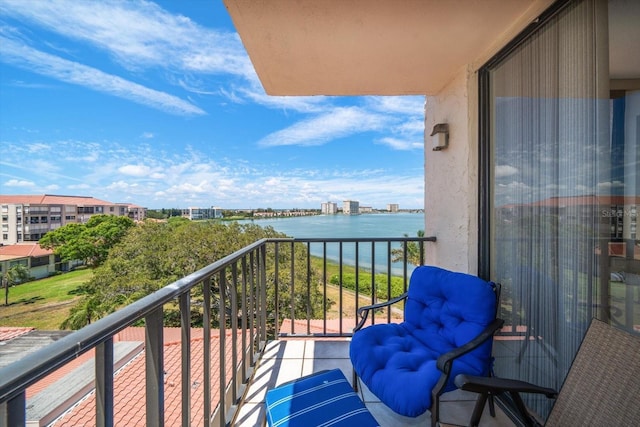 balcony featuring a water view