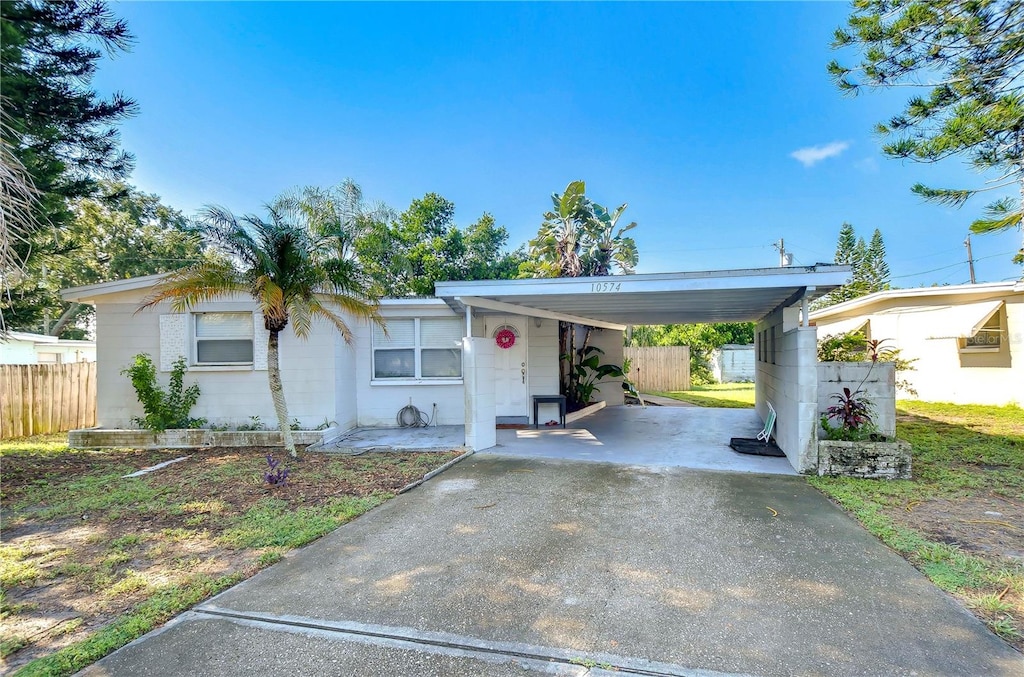 single story home featuring a carport