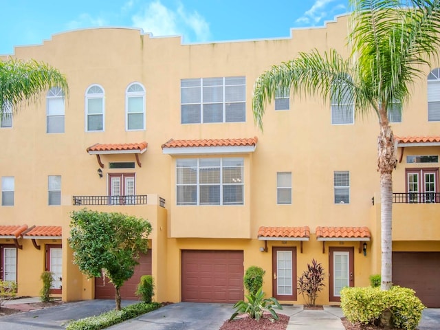 view of front of house with a balcony and a garage