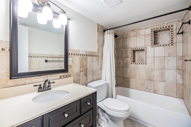 full bathroom with vanity, toilet, shower / bath combination with curtain, and tile walls