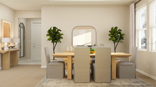 carpeted dining area featuring baseboards